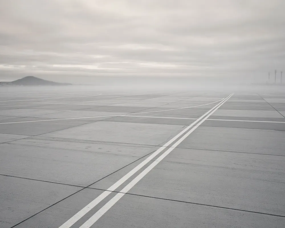 Editorial photograph of runway seams on concrete